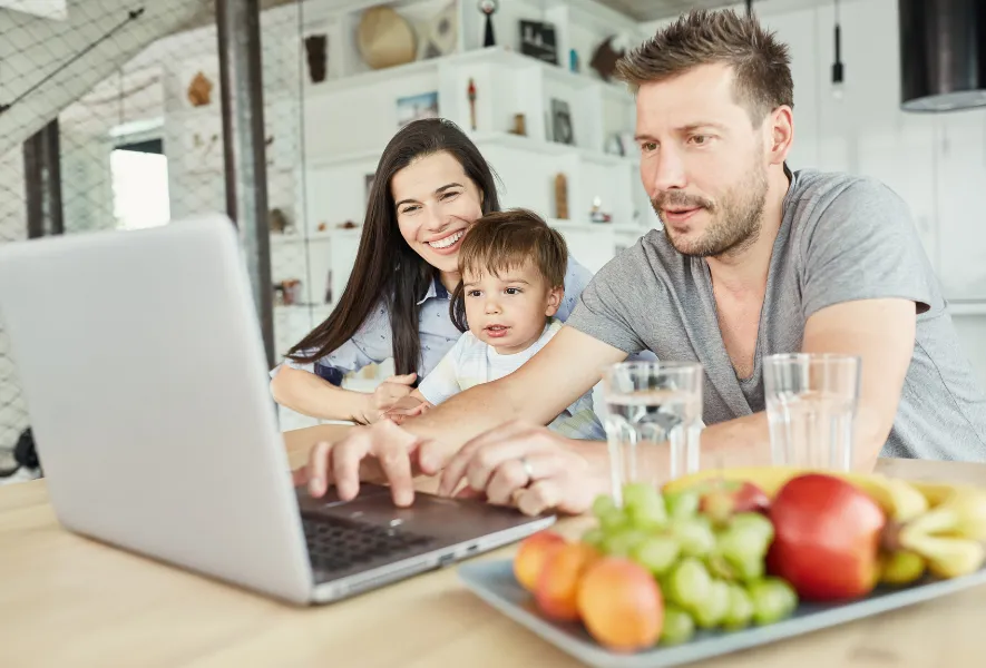 family accessing mortgage chat bot on computer