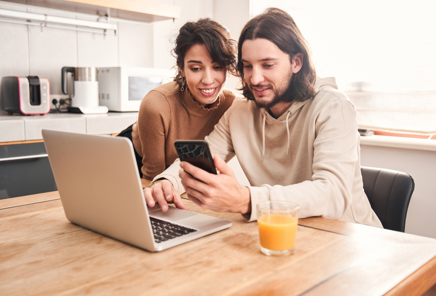 millennial couple applying for mortgage online